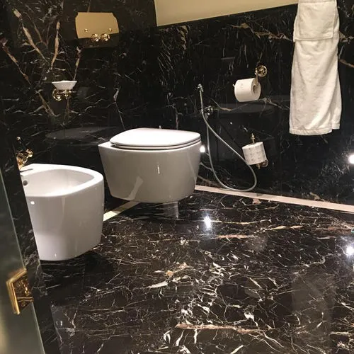 Stunning bathroom ideas featuring Noir Saint Laurent marble panels, matte finish.